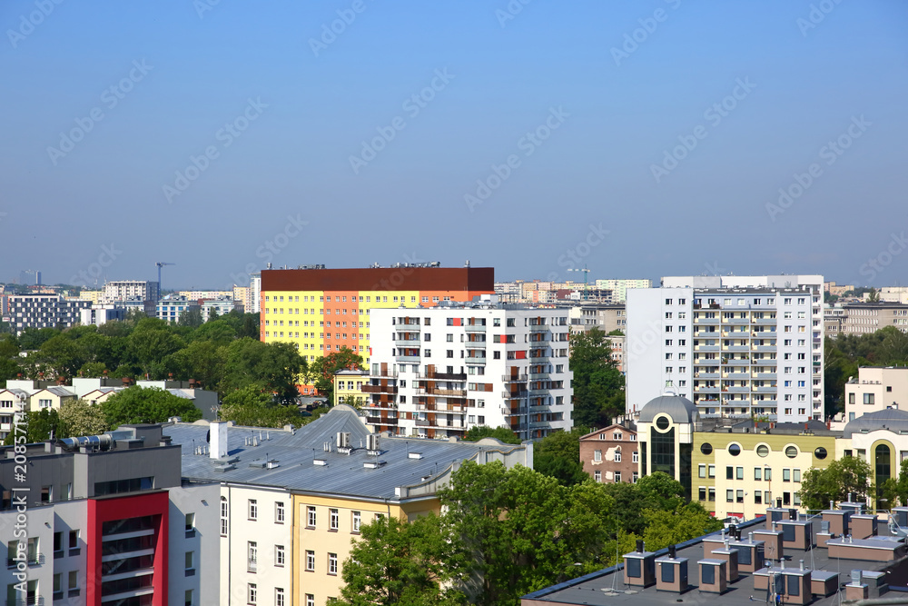 Panorama of the city of Lublin in Poland full of blocks and green trees.
