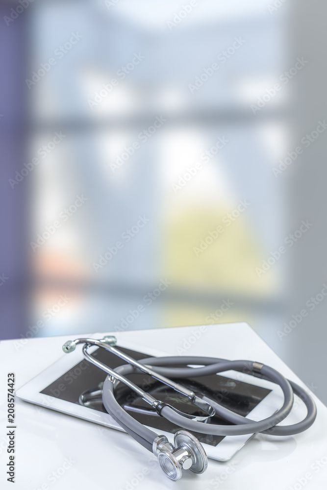 Closeup of medical stethoscope on a rx prescription, isolated on white background Closeup of medical stethoscope on a rx prescription, isolated on white background