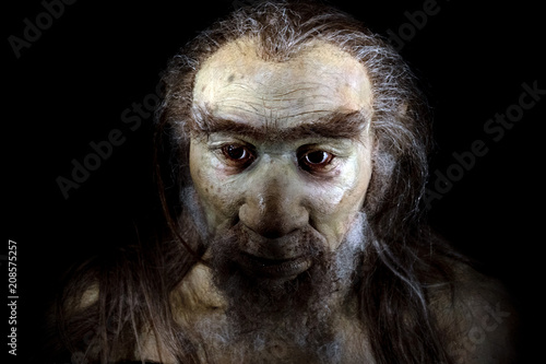 homo sapiens man isolated on black photo