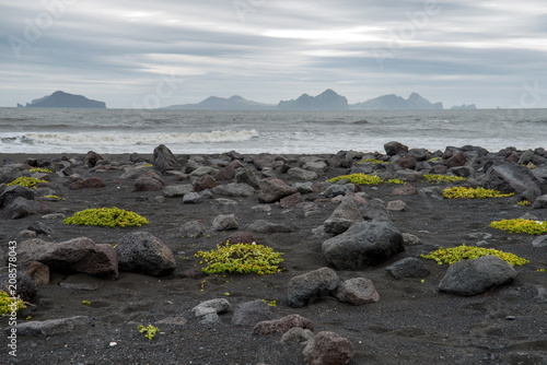 Iceland southern coast with black  beach Landeyjarsandur and Vestmannaeyjar islands. The Westman Islands in the background photo