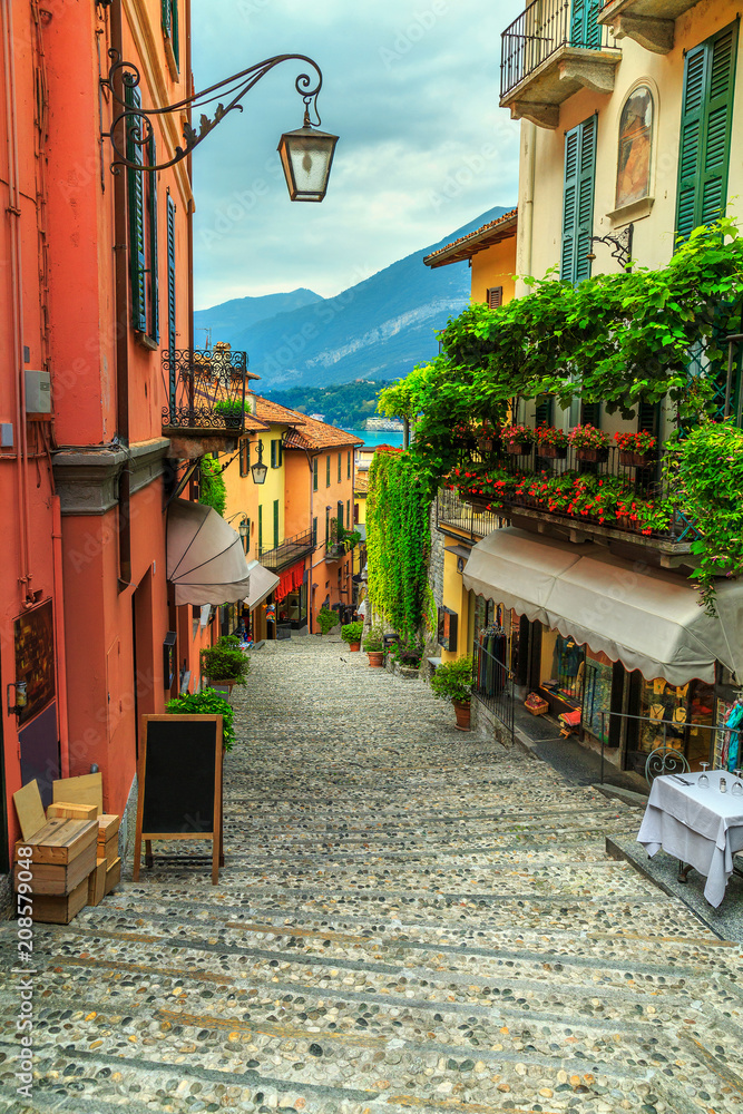 Stunning scenic street with colorful houses and flowers in Bellagio - obrazy, fototapety, plakaty 