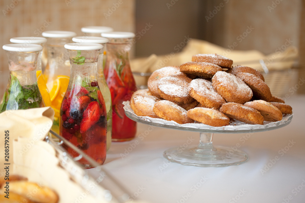 fruit drinks and cookies on the table
fruit drinks and cookies on the table