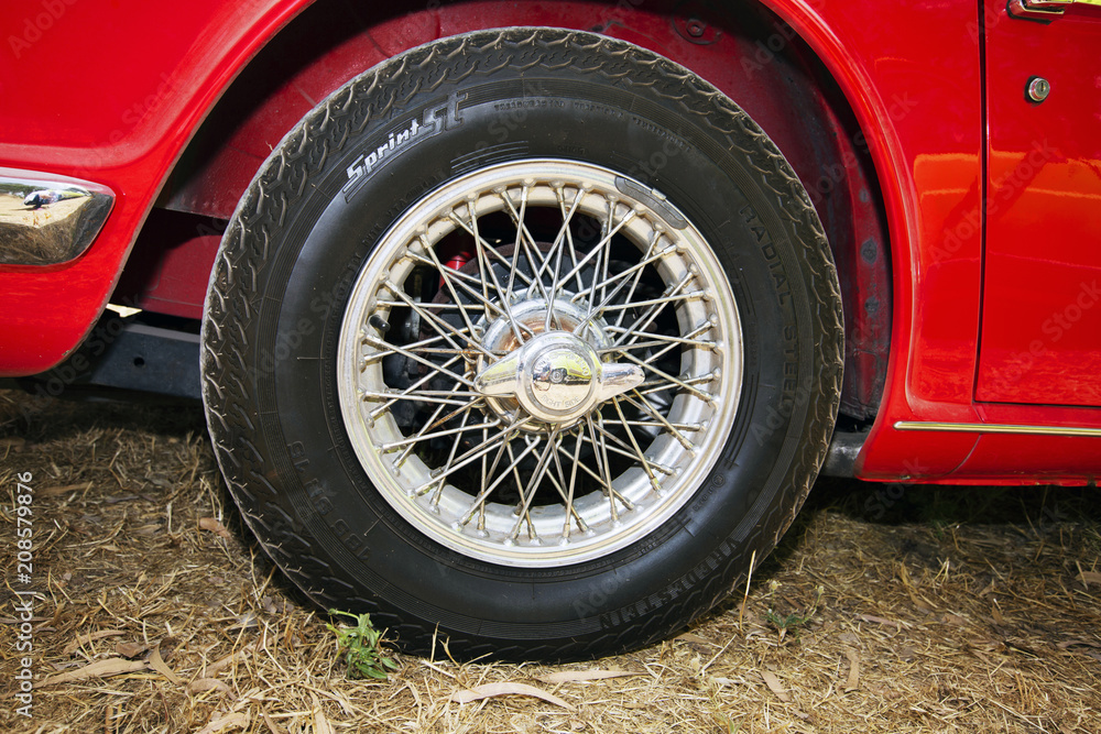ISRAEL, PETAH TIQWA - MAY 14, 2016: Exhibition of technical antiques. Front view of tire in Petah Tiqwa, Israel ISRAEL, PETAH TIQWA - MAY 14, 2016: Exhibition of technical antiques. Front view of tire in Petah Tiqwa, Israel