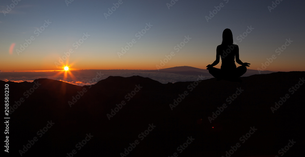 Yoga practicioner during the sunset meditation