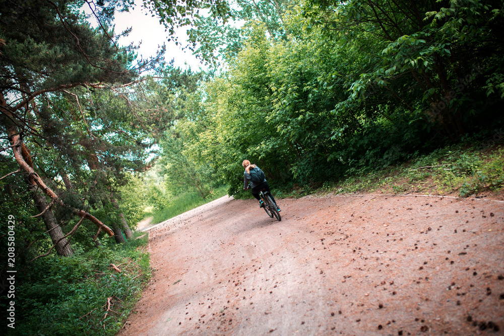 cyclist on a forest road