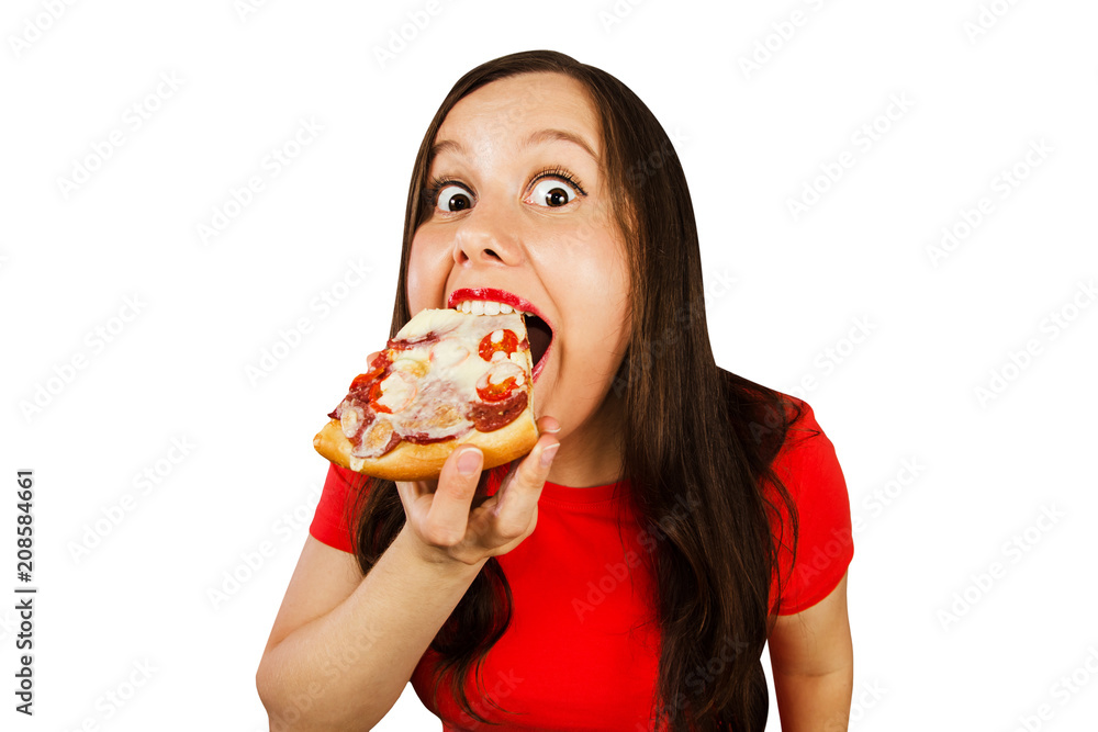 Young beautiful girl greedily devouring pizza, isolated on white background.