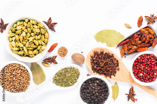 Exotic herbal Food concept Mix of the organic Spices cardamom pods, bay leaves, star anise, peppercorn, chilli, nutmeg,Sichuan peppercorns and coriander seeds