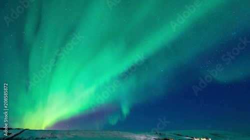 Wallpaper Mural 4K Timelapse movement of strong bright Aurora Borealis above the snow covered on the field mountain, northern Iceland Torontodigital.ca