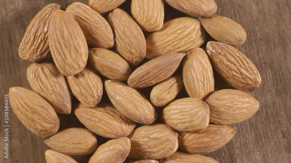 Almond rotating on a white plate. Seamless loopable. Prores 4K. Almond rotating on a white plate. Seamless loopable. Prores 4K.