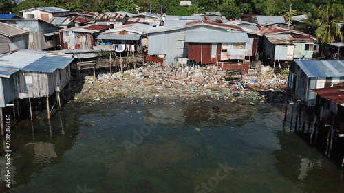Pollution problem in poor fishing village. Plastic garbage in ocean