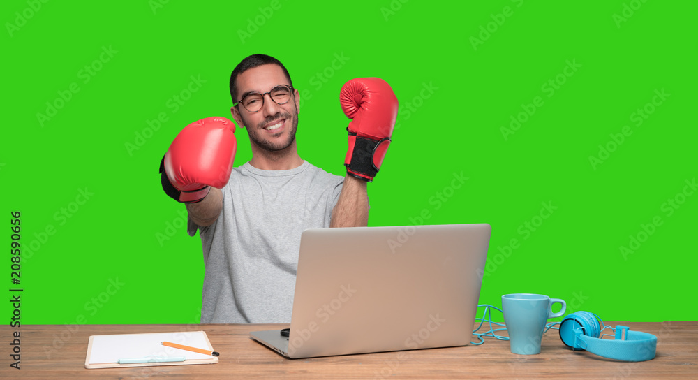 Concept of a happy young man fighting against prices on internet - Green background Concept of a happy young man fighting against prices on internet - Green background
