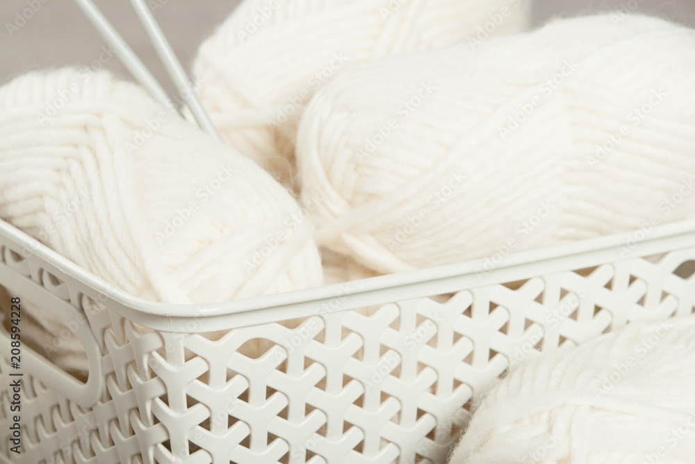 Natural Wool Yarn Balls. Knitting Needles. Natural Wool Yarn Balls. Knitting Needles.