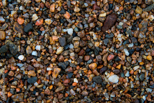 Colorful small stones closeup on beach of of Lake Baikal, Russia.
