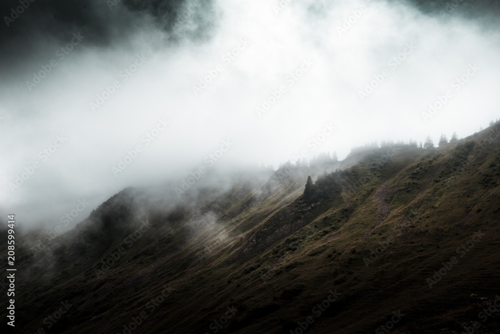 Landscape with low clouds covering mountains Landscape with low clouds covering mountains
