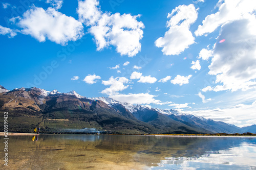 Beautiful landscape of Alps mountain and lake on a sunny day with blue sky.