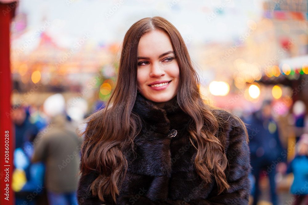 Young beautiful woman in white short mink coat Young beautiful woman in white short mink coat