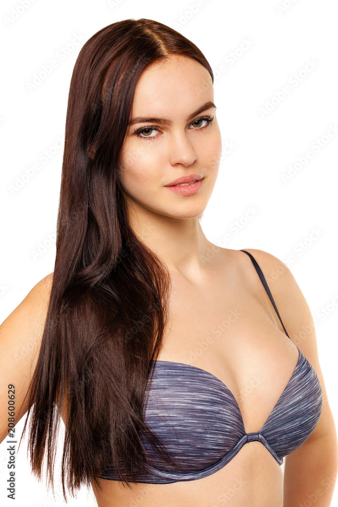 Obraz premium Young sexy brunette woman in blue bra