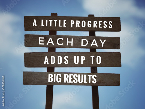 Wallpaper Mural Motivational and inspirational quote - ‘A little progress each day adds up to big results’ on plank signage
