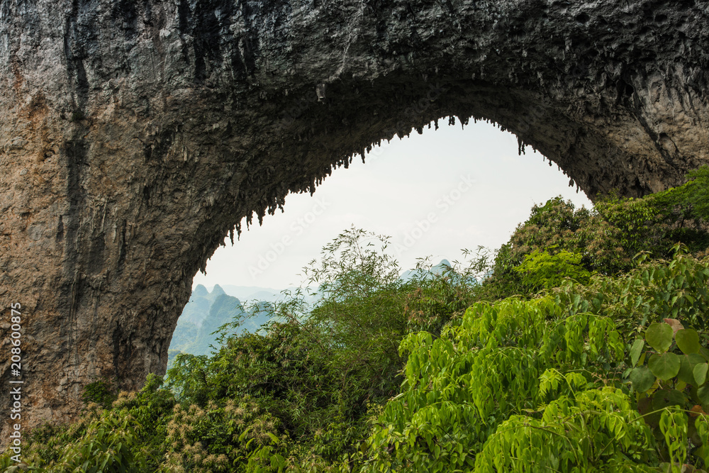 Scenic summer sunny landscape at Moon Hill, Yangshuo County of Guilin, China.