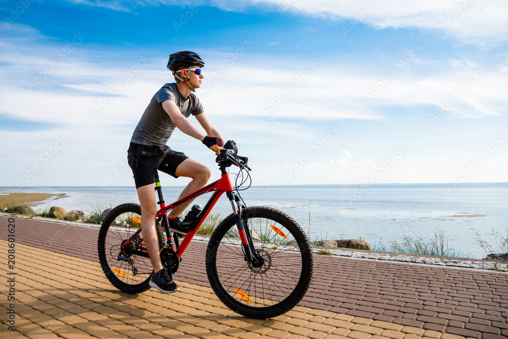 Naklejka premium Young man biking