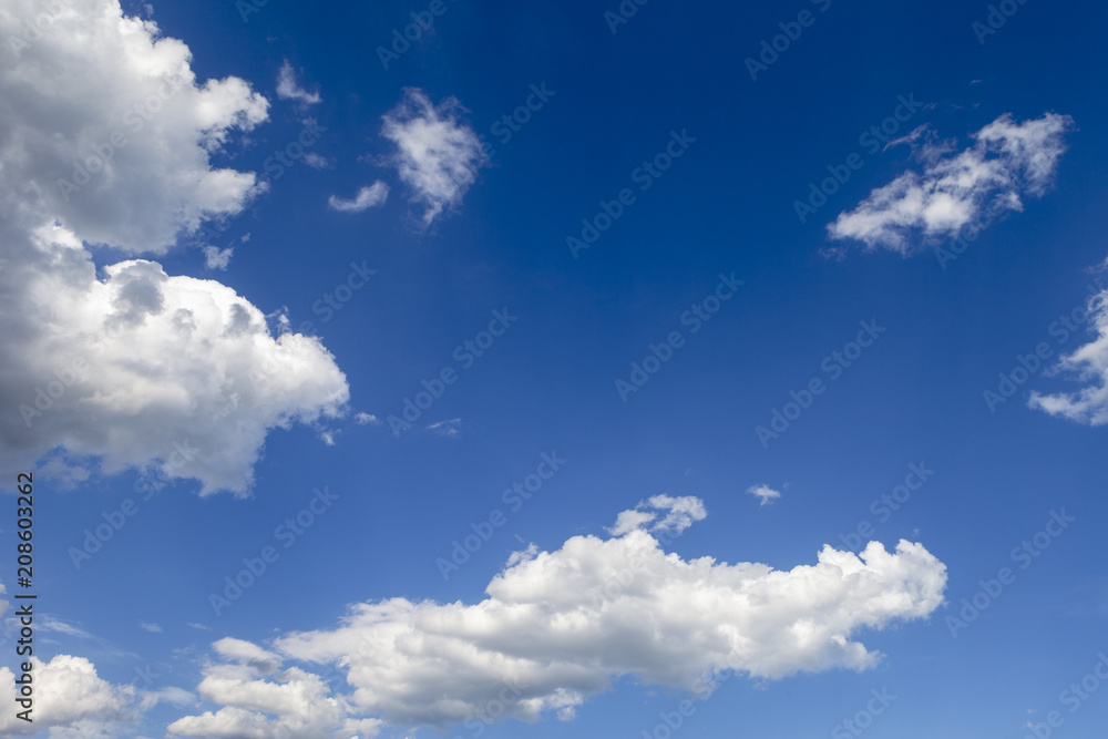 Blue sky background with clouds.