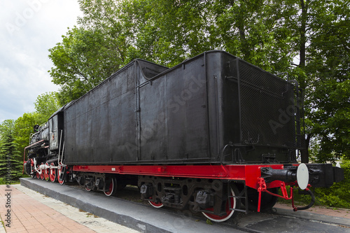 The locomotive-monument L-3291. Powerful, beautiful Russian locomotive. Wheels close-up. Steam engine.