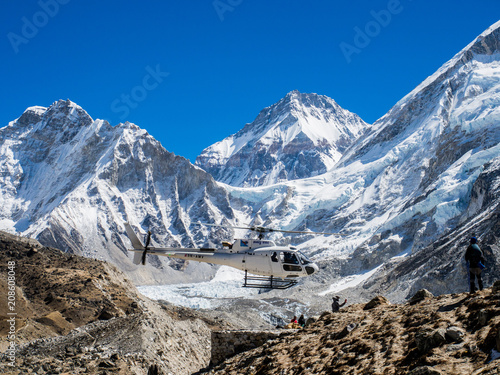 Lobuche, Nepal 04/16/2018 : Rescued Helicopter with the beatiful snow capped mountain as a background 
