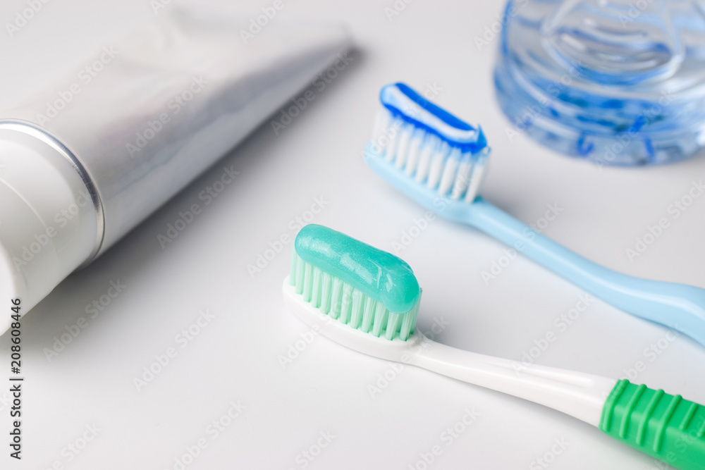 Toothpaste on a toothbrush on white background Toothpaste on a toothbrush on white background