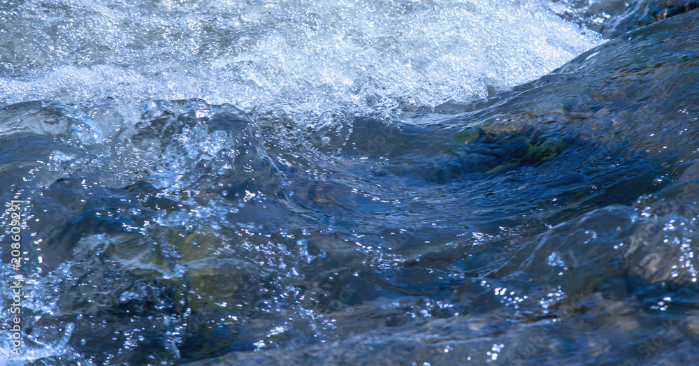 Long exposure shot of rapid mountain river. Water texture background. Long exposure shot of rapid mountain river. Water texture background.
