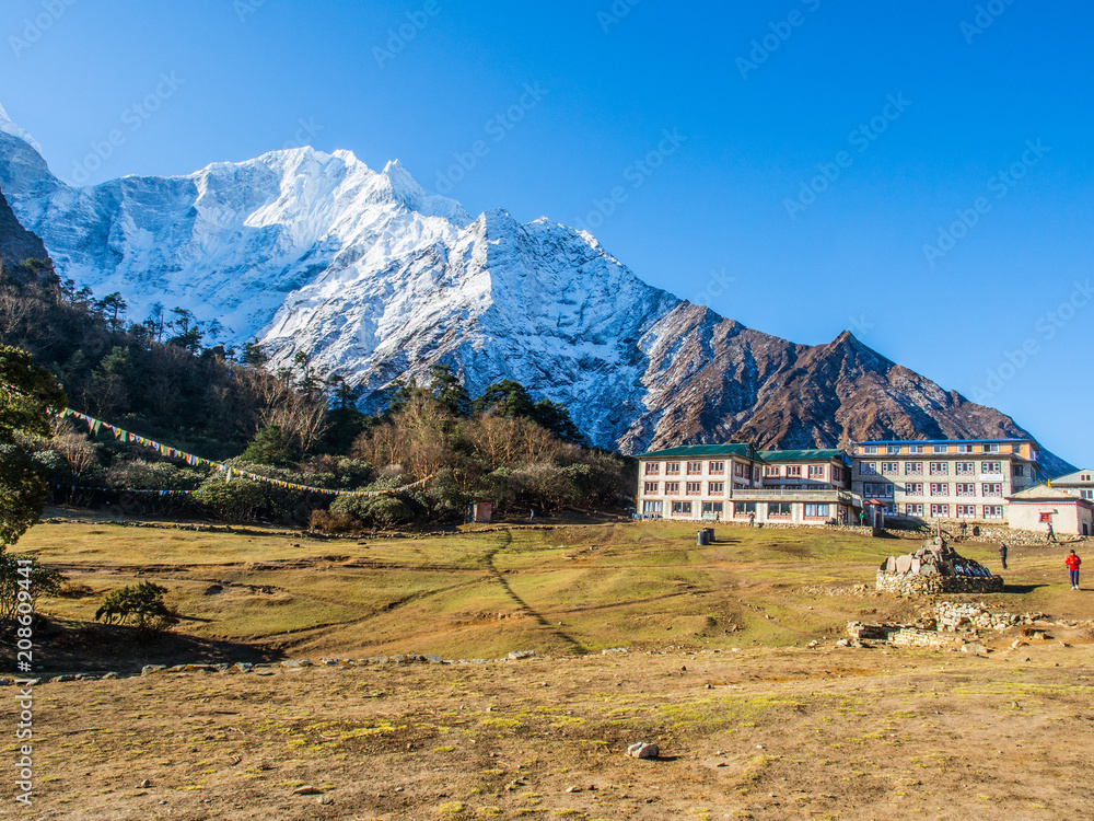 Small Village in Nepal with the beautiful snow capped mountain background 