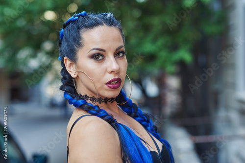 portrait of a young fashionable woman in the city