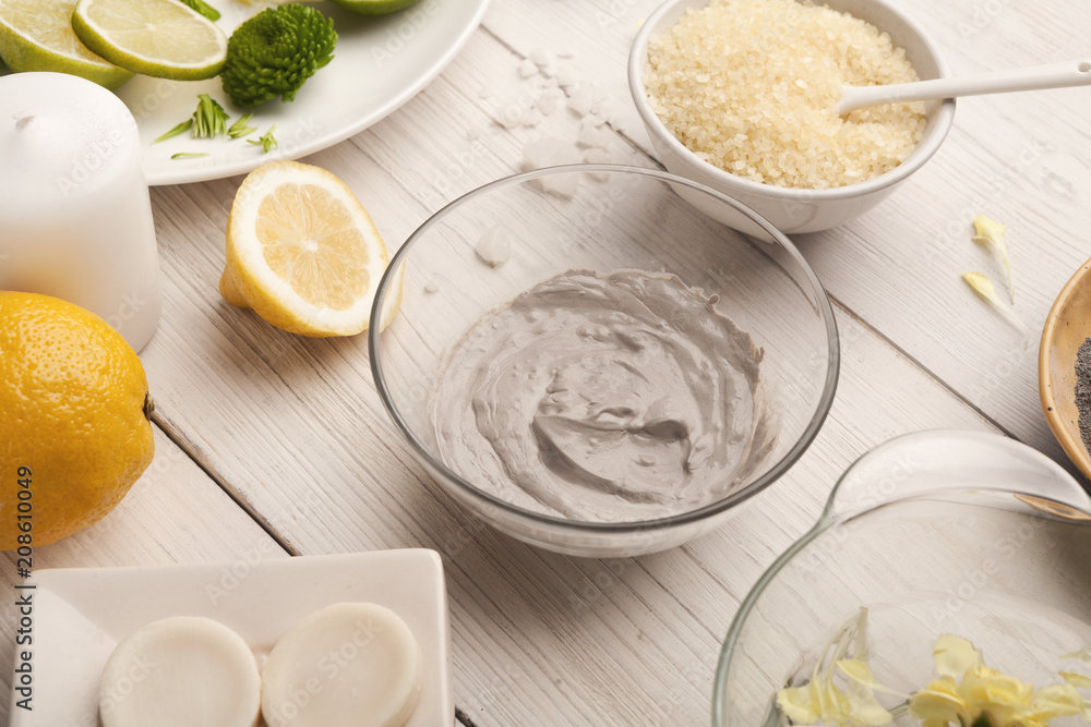 Mud mask emultion on white wooden table