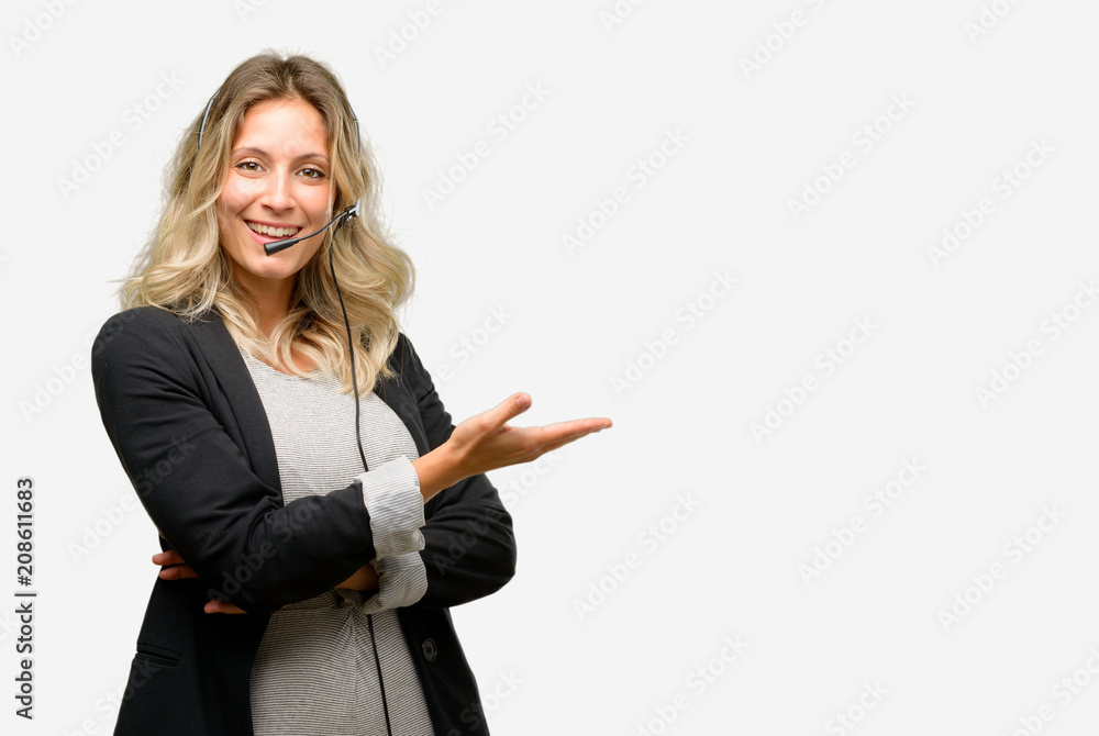 Young woman operator from call center holding something in empty hand Young woman operator from call center holding something in empty hand