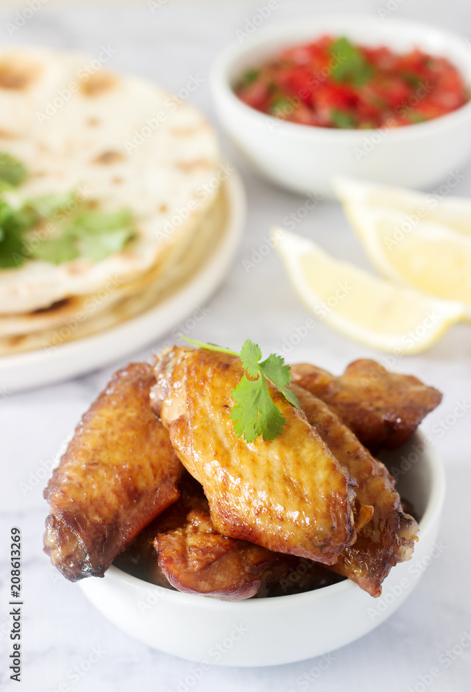 Homemade delicious food of tortillas, salsa and fried wings. Homemade delicious food of tortillas, salsa and fried wings.