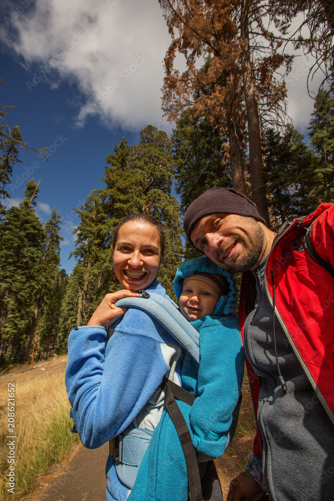 Family with infant visit Sequoia national park in California, USA Family with infant visit Sequoia national park in California, USA