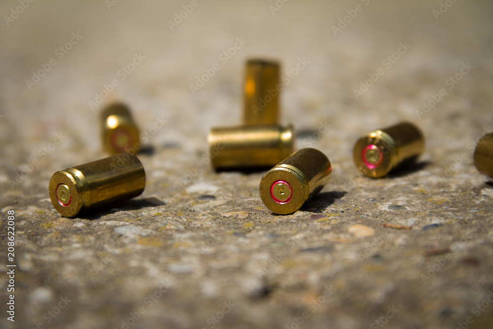 9 mm bullet shells. It's lying on the ground 9 mm bullet shells. It's lying on the ground