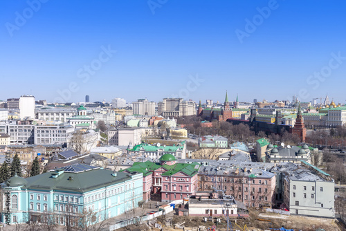 view of Moscow cityscape, old historical town and urban skyscrapers (Moscow International Business Center background) with sunny blue sky, Moscow city, Russia