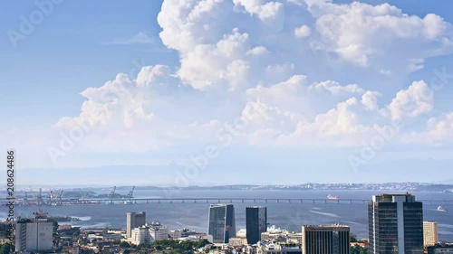 Aerial time-lapse of downtown and port area showing the movement of clouds, boats, birds and cars in the Rio-Niterói bridge. Rio de Janeiro, Brazil.