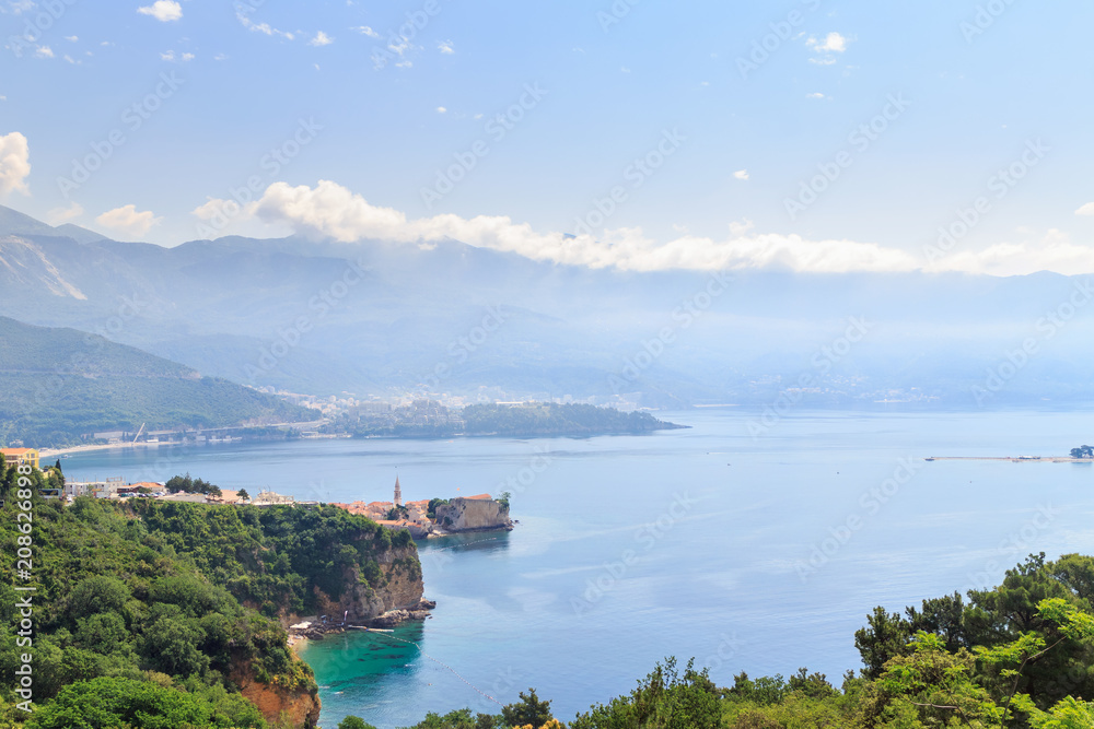 View from above on the Adriatic sea coast with mountains and old city Budva in Montenegro. travel, seascape background and nature landscape