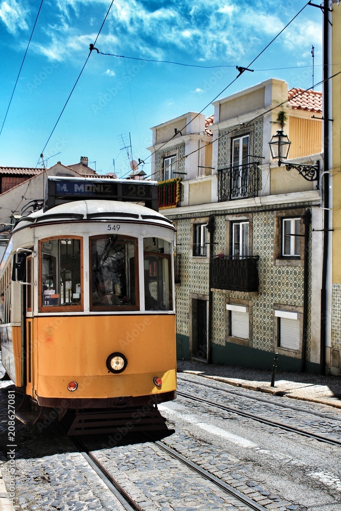 Colorful trams through the streets of Lisbon in Spring