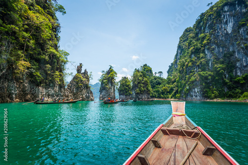 wooden longtail boat trip adventure at Ratchaprapa dam, Thailand