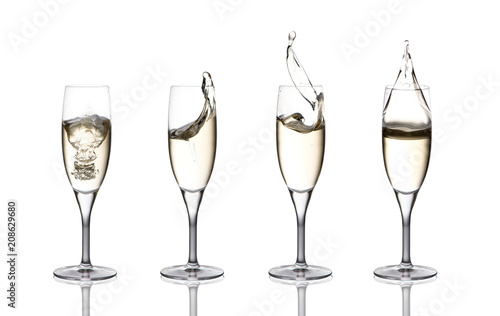 a splash of champagne in glasses on a white background
