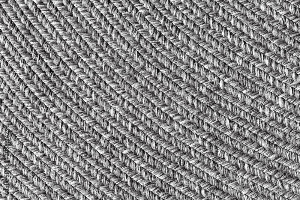 Jute braided home spiral rug background texture pattern - close-up Jute braided home spiral rug background texture pattern - close-up