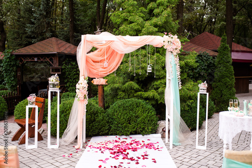 Beautiful wedding decorations and Arch of flowers. Stylish wedding. photo