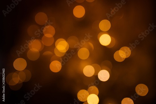Beautiful holiday lights, blurred Bokeh. Gold and warm shades.