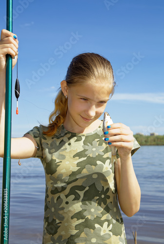 A teenage girl mocking her catch