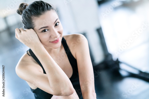 Fototapeta Naklejka Na Ścianę i Meble -  attractive caucasian woman relax after workout with happiness and joyful in gym healthy ideas concept