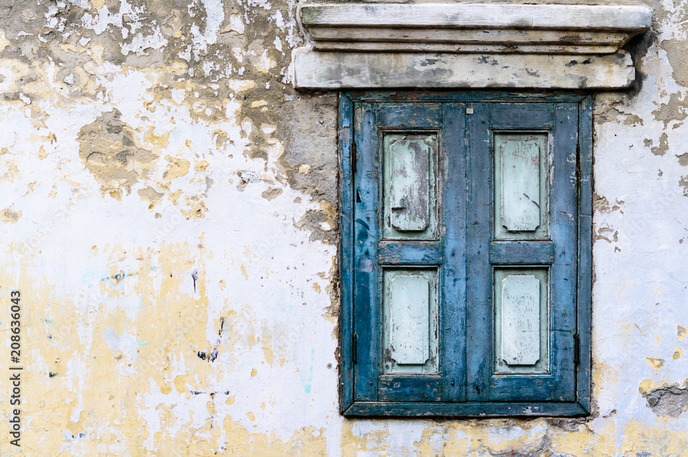 Old blue wooden window with concrete wall Old blue wooden window with concrete wall