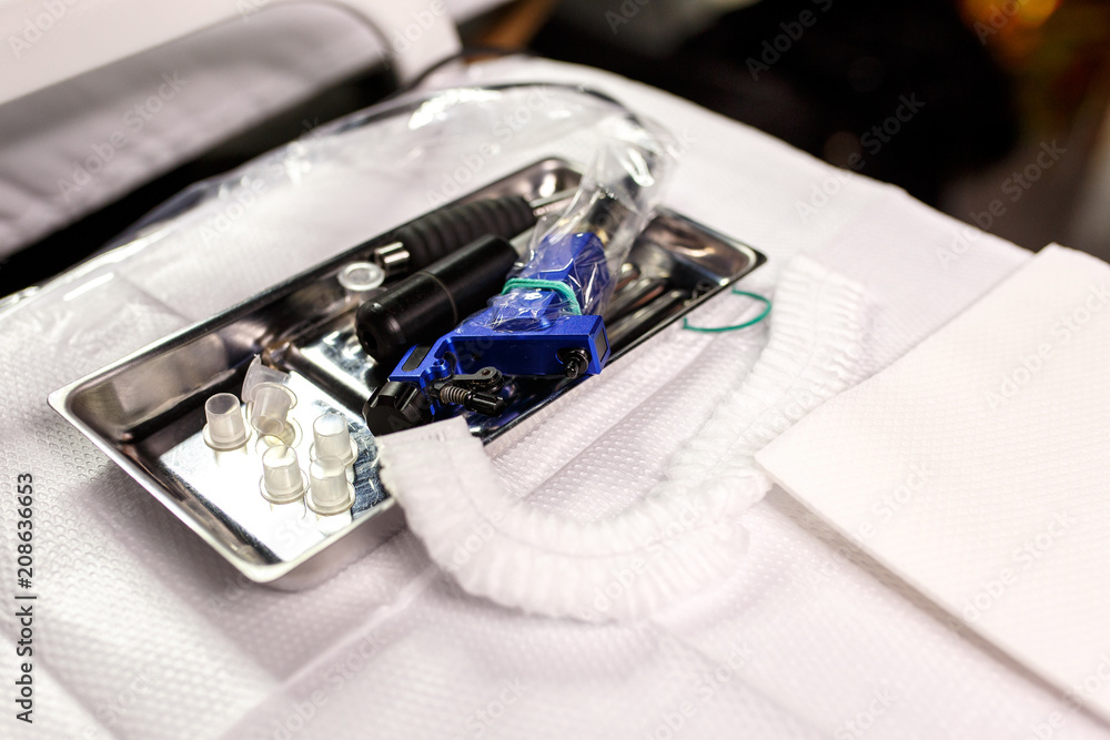 various tools for professional permanent makeup on medicine table. eyebrow embroidery instruments various tools for professional permanent makeup on medicine table. eyebrow embroidery instruments