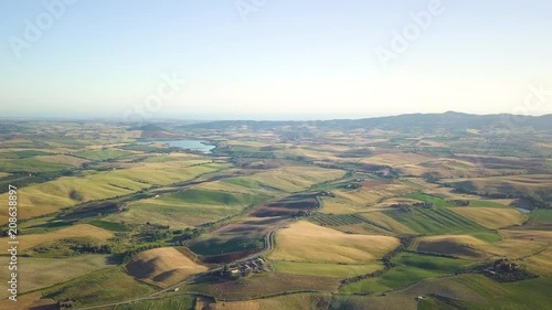 Vista aerea di un bellissimo paesaggio collinare con immensi prati e dune. Val D'Orcia in Toscana  photo